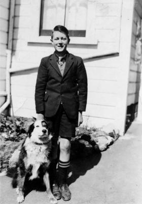A unidentified boy and a dog