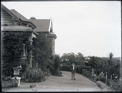An unidentified man and woman outside a villa, Napier Hill