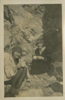 Two women having tea on the rocks