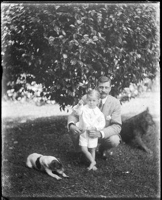 Man with child and dog