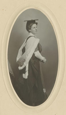 Bessie Spencer in graduation gown; Mason, F W