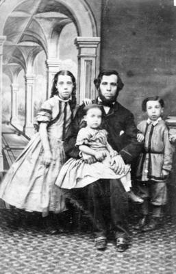 Portrait of an unidentified man and children
